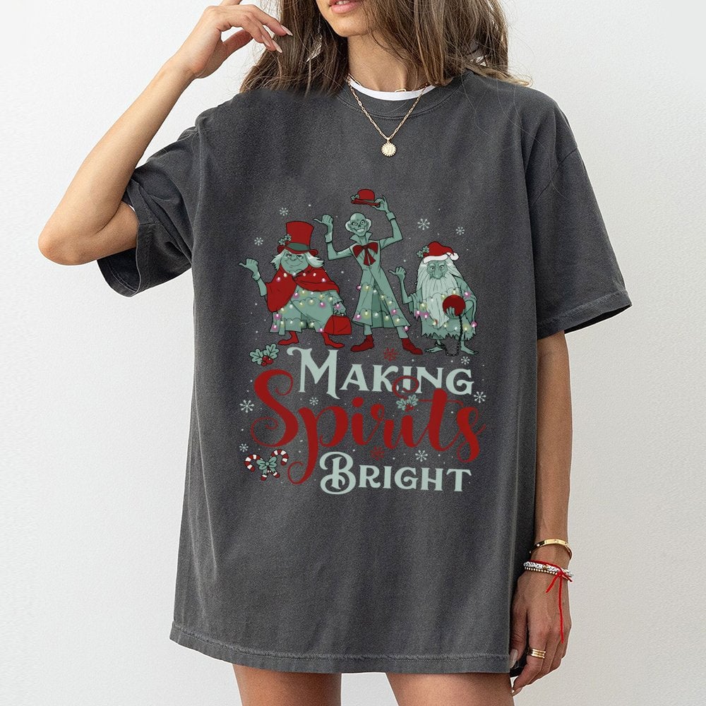 Making Spirits Bright T-Shirt | Haunted Hitchhiking Ghosts Design | Premium Cotton Christmas Graphic Tee | Spooky Holiday Gif